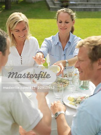 Adults having garden party