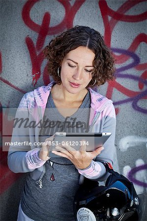 Woman with helmet and ipad