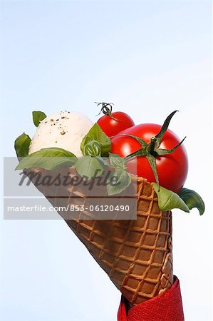 Ice cream cone with tomato and Mozzarella