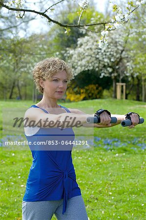 Woman with dumbells