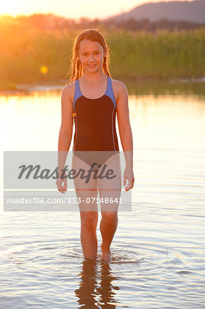 A Young Teenage Girl In A Bikini Standing At The Waters Edge. Stock Photo,  Picture and Royalty Free Image. Image 42149309.
