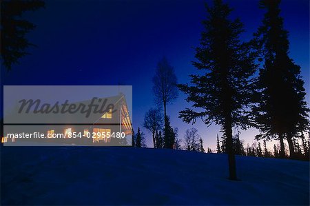 Log cabin home at dusk/nFinger Lake AK