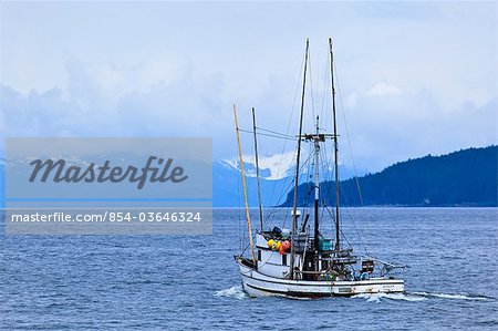 Commercial salmon troller *Avalon* leaving Juneau on an overcast day, Southeast Alaska, Summer