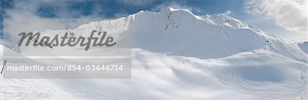 Winter scenic of Alyeska Ski Resort's Glacier Bowl with visible ski tracks, Girdwood, Southcentral Alaska, Winter