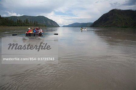 Two rafts of families float down the Yukon River, Yukon-Charley Rivers National Preserve, Interior Alaska, Summer