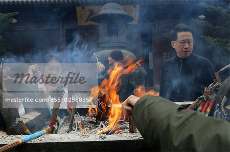 Worshipper burning the incense at Lonhua Temple, Shanghai