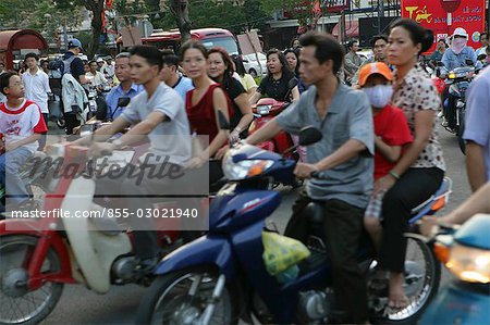 People on motobike on Nguyen Hue St,Ho Chi Minh City,Vietnam