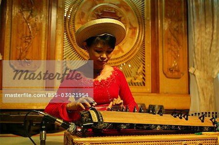 A guzheng player on show at Rex Hotel,Ho Chi Minh City,Vietnam