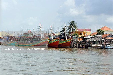 Boats anchoring at riverside,Vietnam