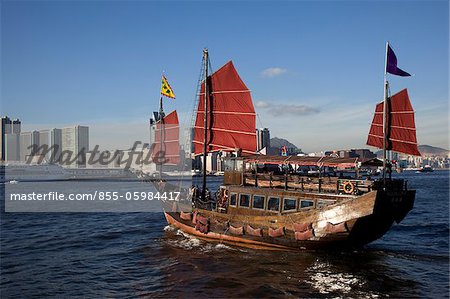 Chinese junk touring at Victoria Harbour, Hong Kong