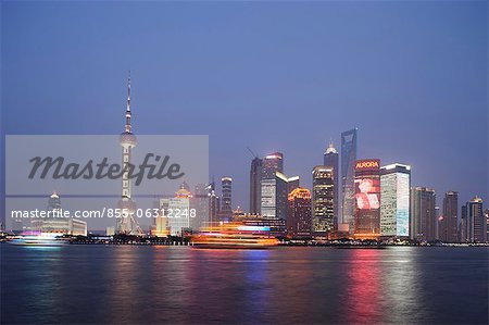 Skyline of Lujiazui Pudong from the Bund at dusk, Shanghai, China