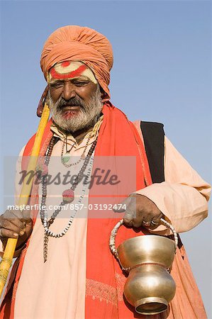 Close-up of a sadhu holding a kamandal, Pushkar, Rajasthan, India