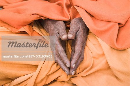 Mid section view of a sadhu praying, Varanasi, Uttar Pradesh, India