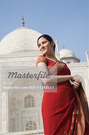 Woman standing in front of a mausoleum, Taj Mahal, Agra, Uttar Pradesh, India