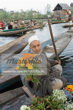 Man selling flowers in a boat, Dal Lake, Srinagar, Jammu And Kashmir, India