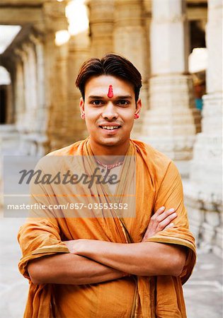 Portrait of a man smiling in a temple, Adinath Temple, Jain Temple, Ranakpur, Pali District, Udaipur, Rajasthan, India