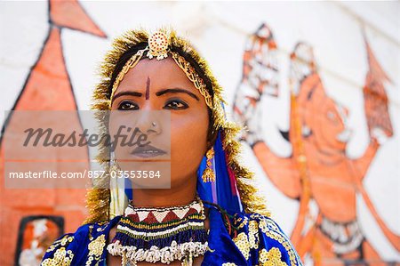 Female folk dancer performing in front of a wall, Jaisalmer, Rajasthan, India