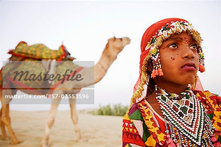 Close-up of a girl with a camel in the background, Jaisalmer, Rajasthan, India