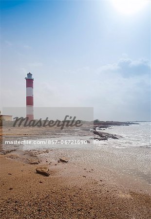 Lighthouse at the coast, Dwarka Beach, Dwarka, Gujarat, India