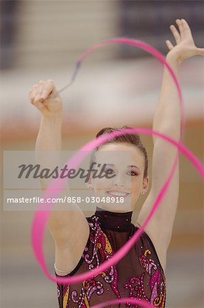 Girl performing rhythmic gymnastics with ribbon