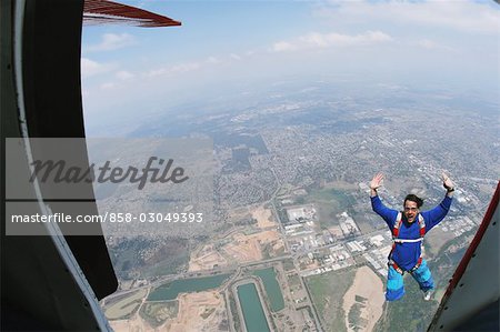 Man jumping from plane