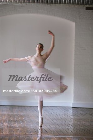 Ballet dancer dancing on floor