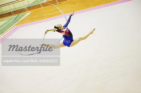 Woman performing rhythmic gymnastics with ribbon