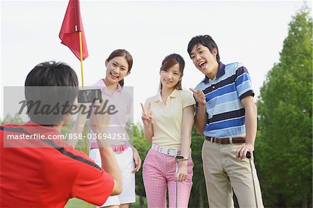 Man Taking A Picture On Golf Course