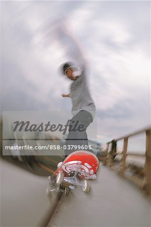 Young adult man skateboarding