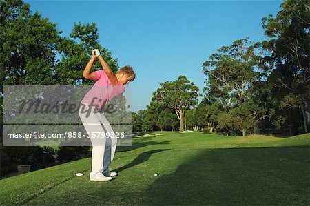 Golfer Swinging