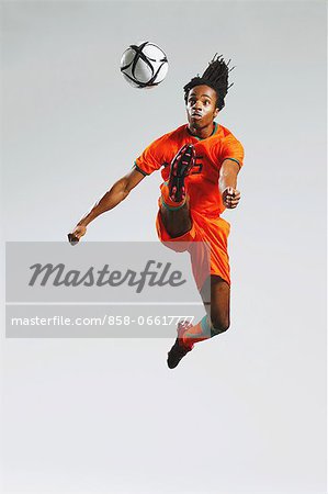 Man In Soccer Uniform With Ball