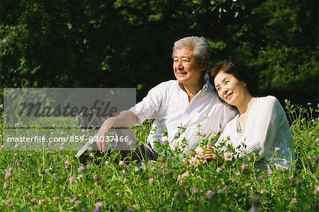 Couple Sitting in Grass