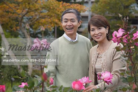 Front view of a smiling middle-aged couple