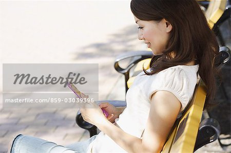 Young Woman Conversing on Mobile Phone