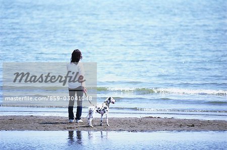 Women With Dog at the Beach