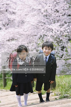 Schoolmates Standing on Stairs in Park