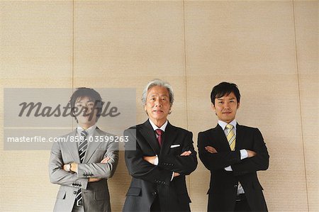 Businessmen Loooking At Camera