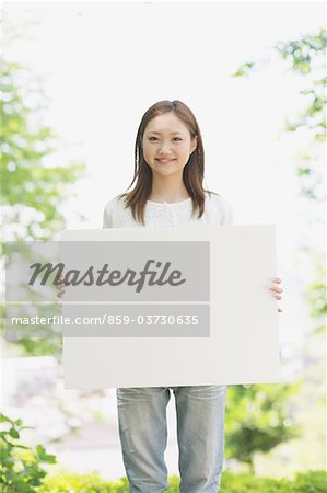 Japanese Woman Holding A Whiteboard