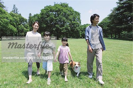 Japanese Family Having Fun In a Park
