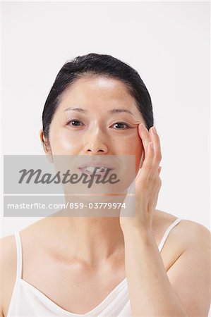 Woman Touching Her Face