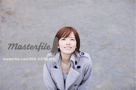 Young Trendy Girl Standing In Street