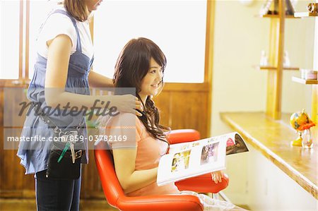 Hairdresser with Client at Beauty Salon