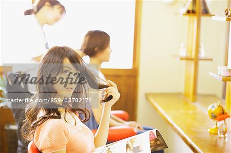 Young Woman Waiting for Haircut in Beauty salon