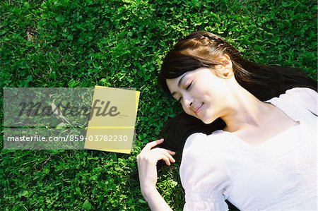 Young Woman  Sleeping on Grass