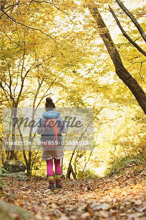 Young Woman Walking Alone In Forest