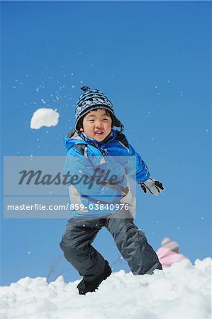 Boy Throwing Snow Ball