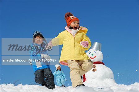 Children Running In Snow