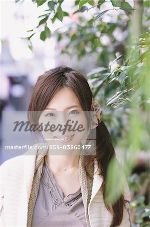 Japanese Women Smiling Near Plants