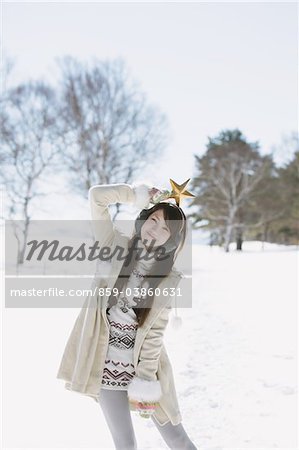 Teenage Girl Holding Star Over Her Head