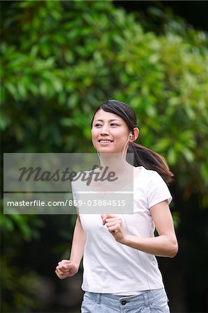 Woman Listening Music while Jogging